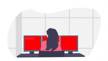 stylized woman sitting in front of 3 computer monitors